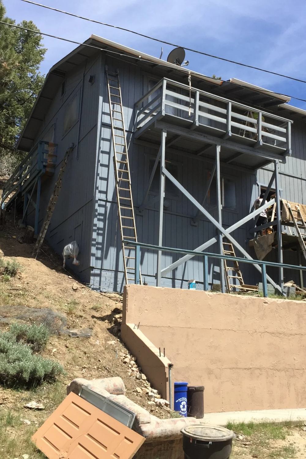 Moonridge home with cool exterior palette by Highland Coat Painting — photo 1 of 4