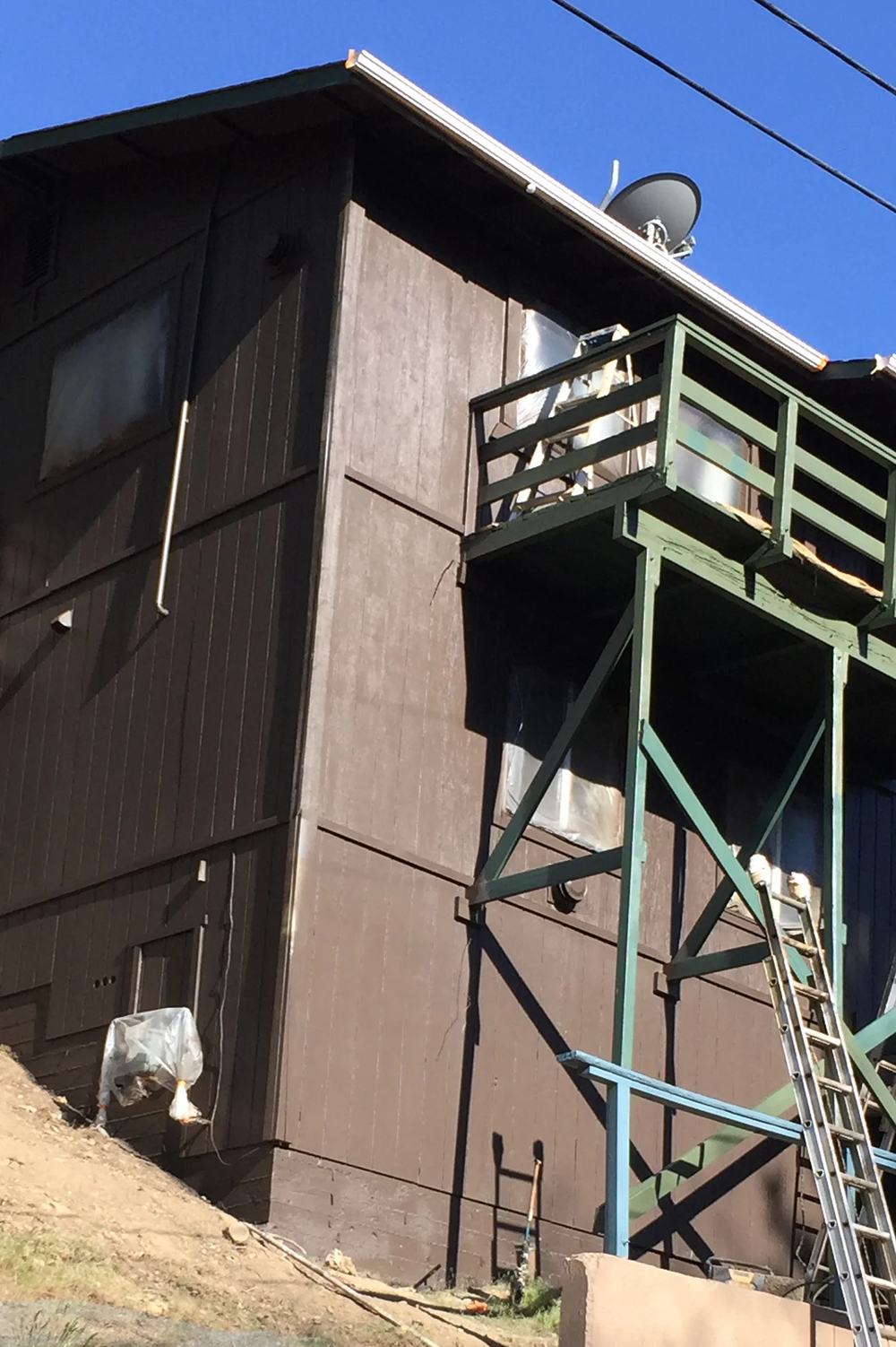 Moonridge home with cool exterior palette by Highland Coat Painting — photo 2 of 4